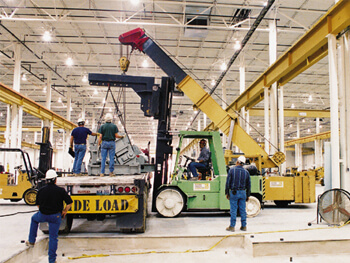 SIC crew operating heavy equipment during a plant relocation project
