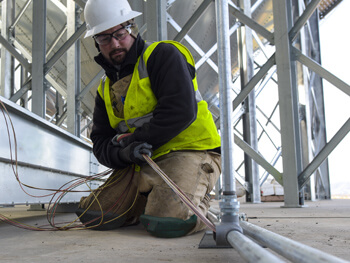 Worker performing industrial construction job in Greensboro.